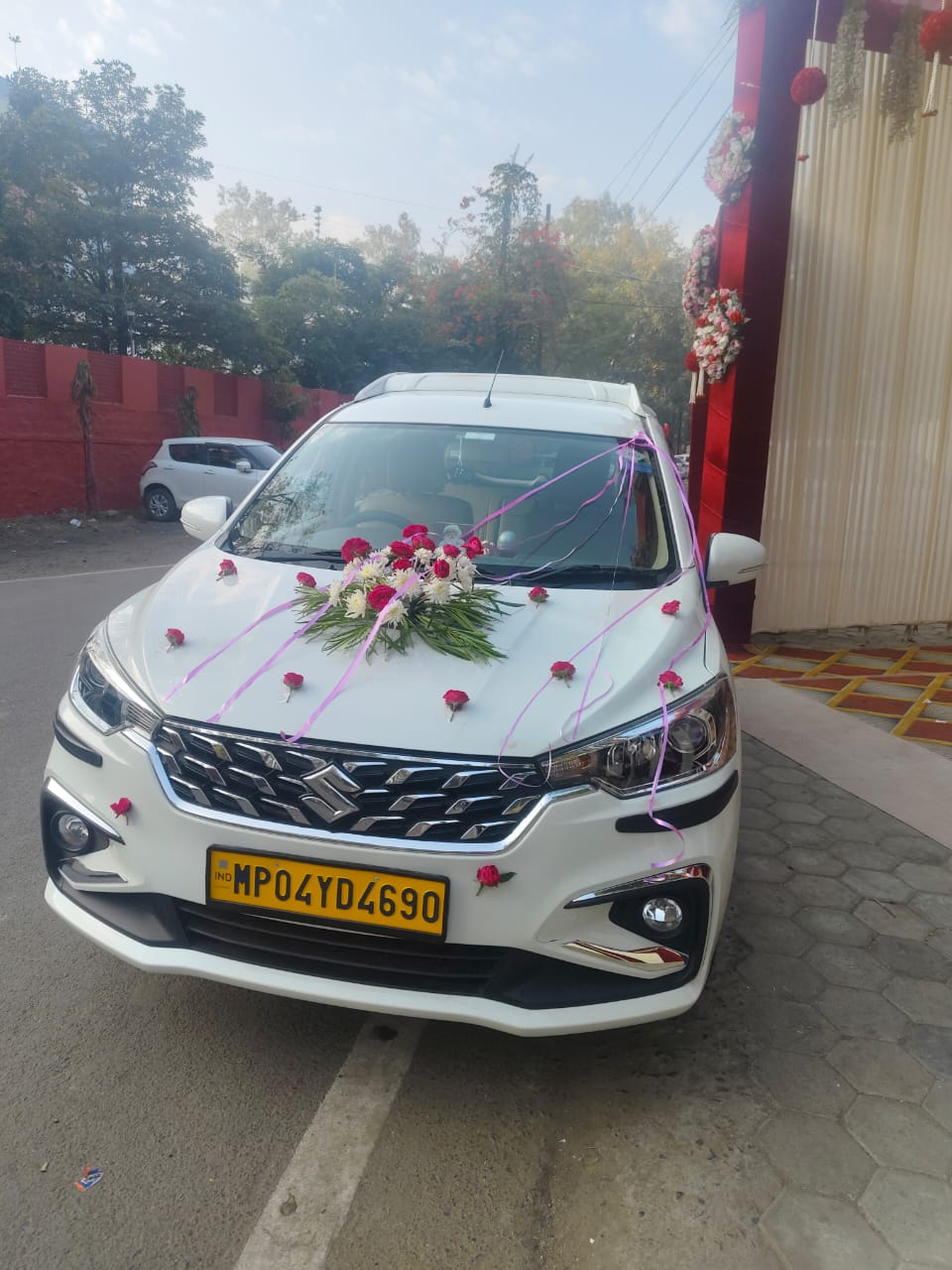 Our Ertiga decorated with flowers for a wedding trip